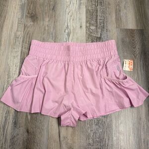 Free people get your flirt on shorts pink size large 
New with tag